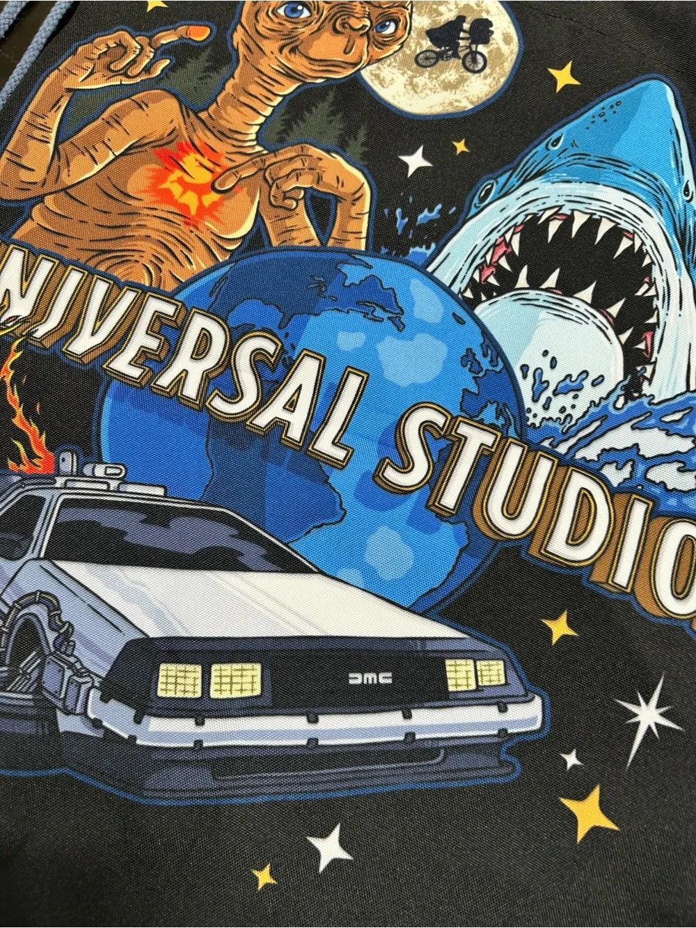 Universal Black Drawstring Backpack with Blue and Multicolor Movie Graphics